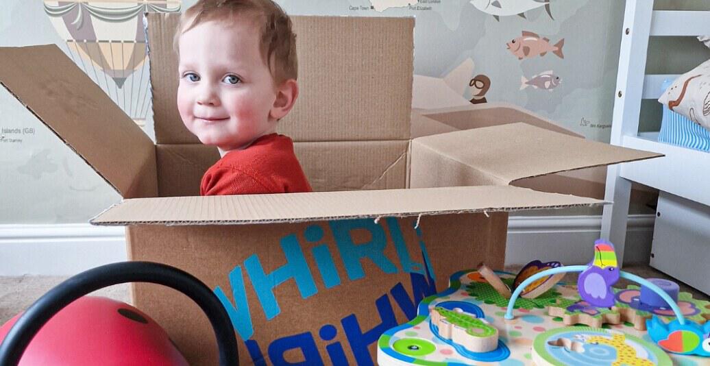 Whirli savings tips guide featuring a child sitting in a Whirli brown boy surrounded by toys