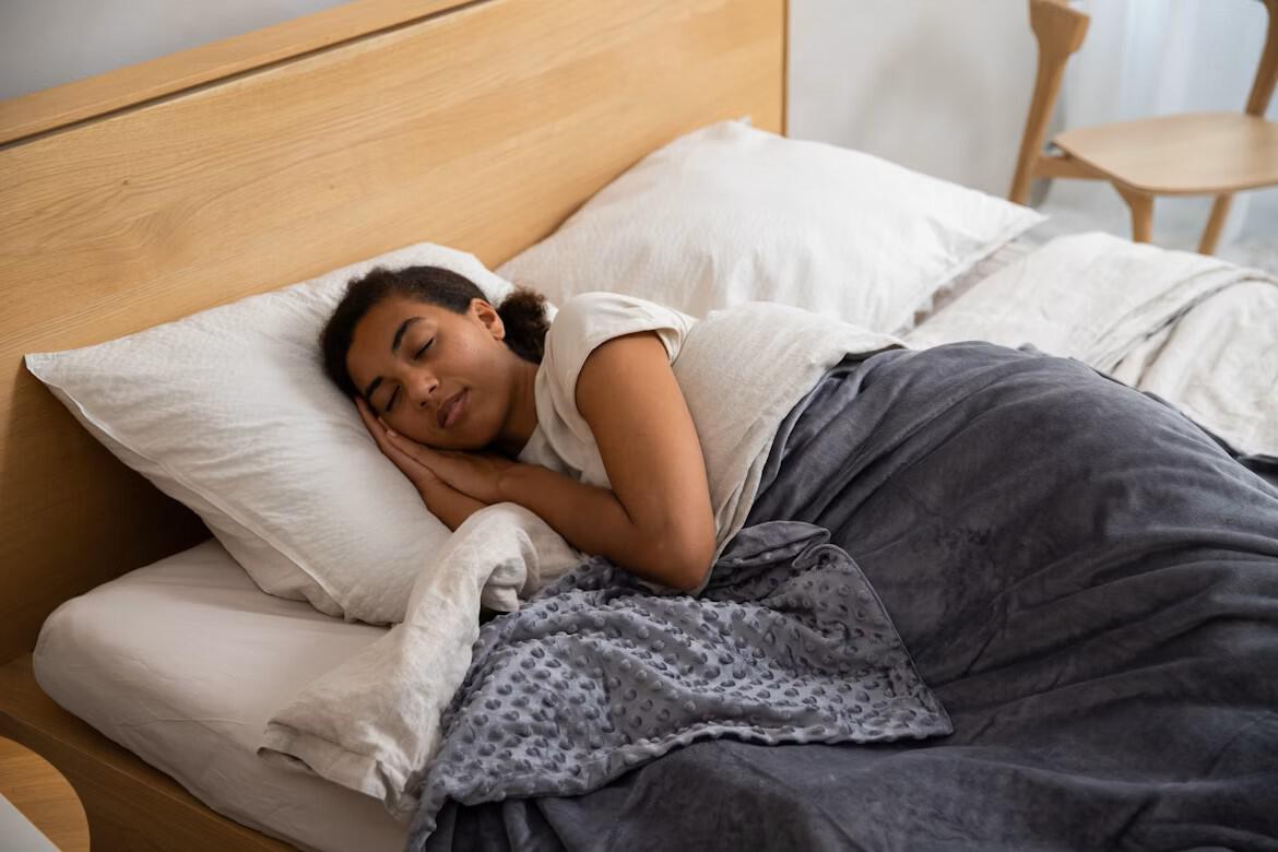Woman Laying in Bed Head on Pillow