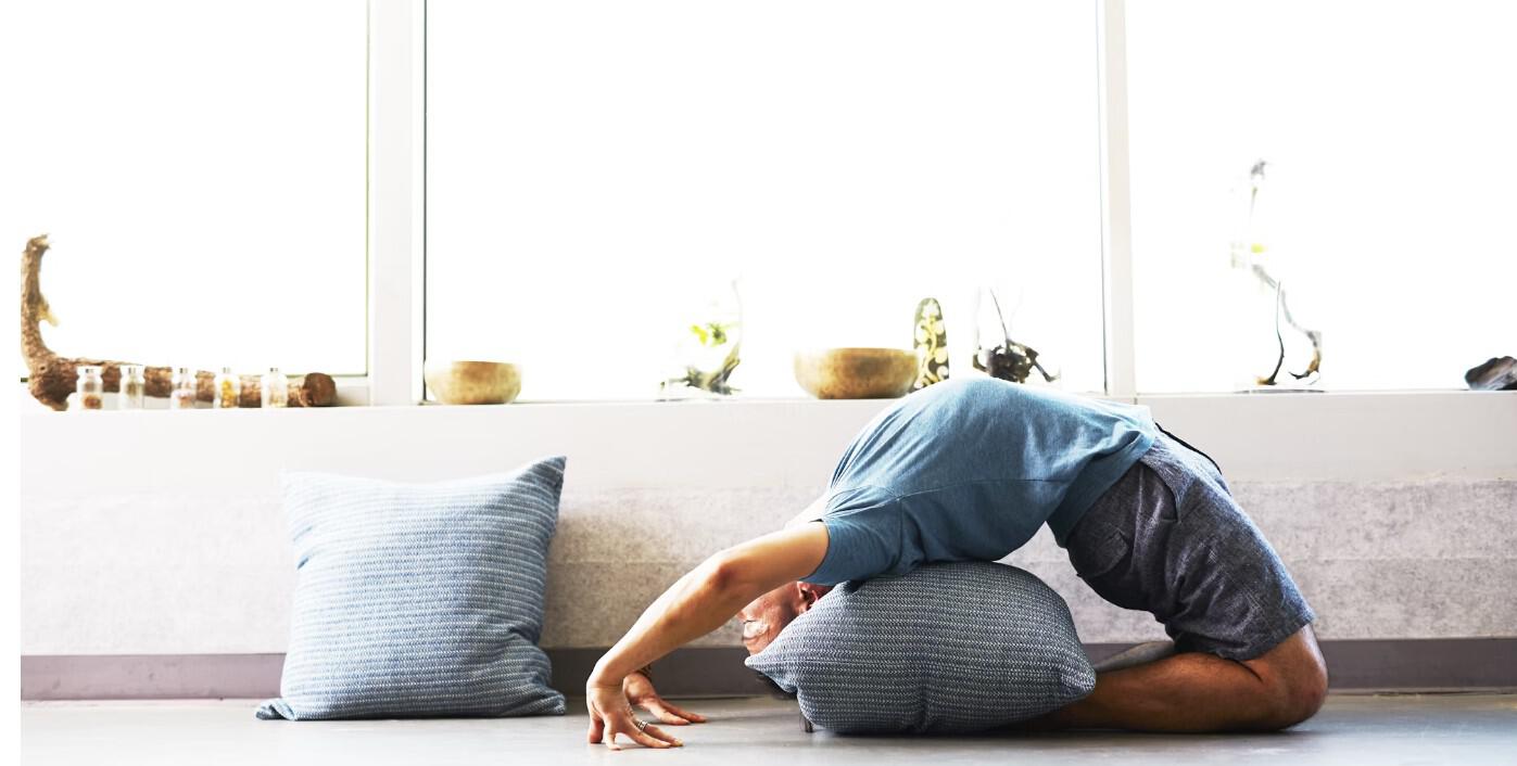 woman-stretching-on-cushion"