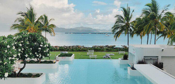 Wotif offers page image showing a resort next to the sea in an exotic location